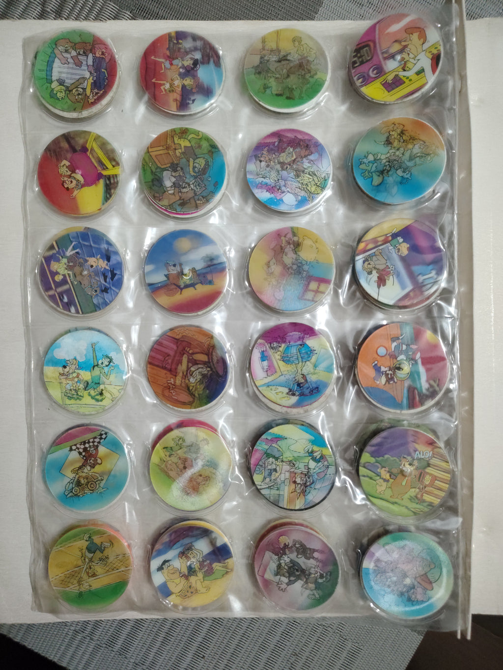 Lote de Tazos Vintage Variados (Picapiedra, Supersónicos, Don Gato y Su Pandilla, Mickey y más) + Álbum